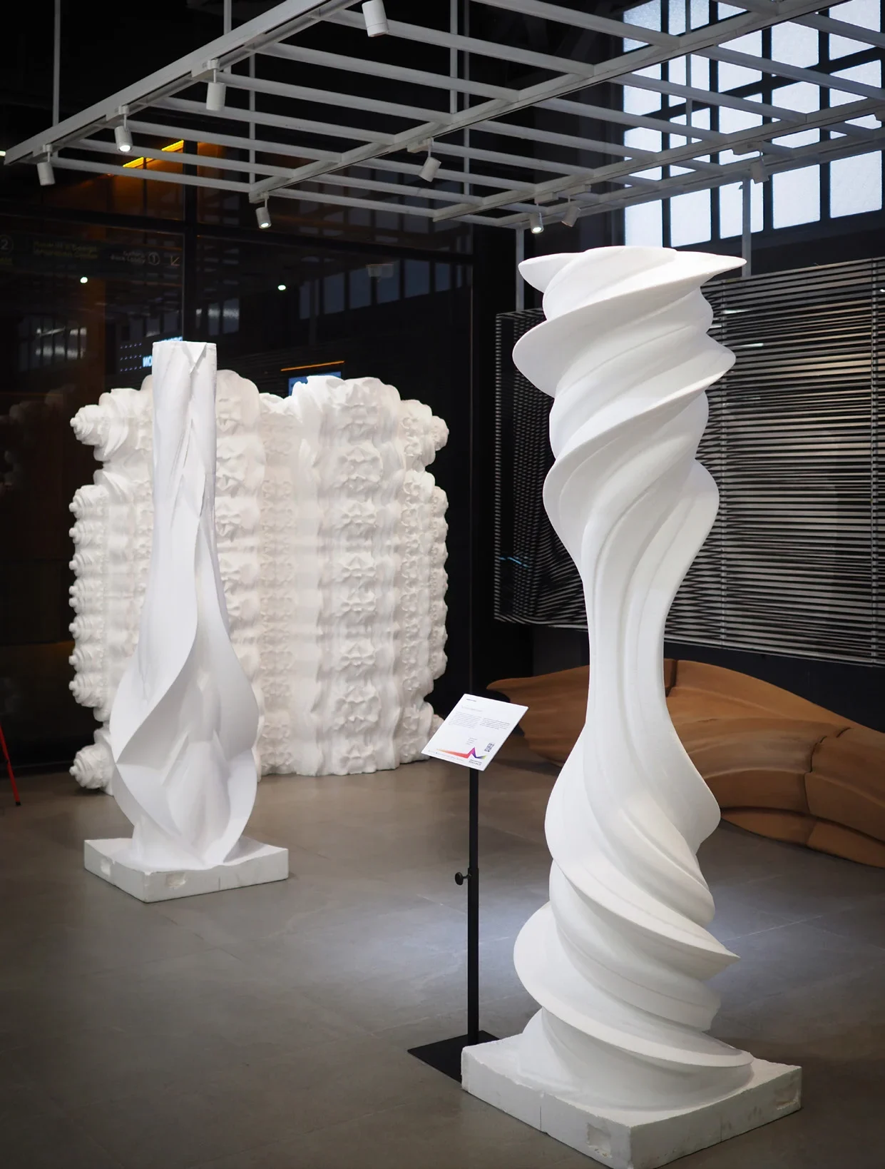 Thai Metamorphosis sculpted columns and patterned wall installation